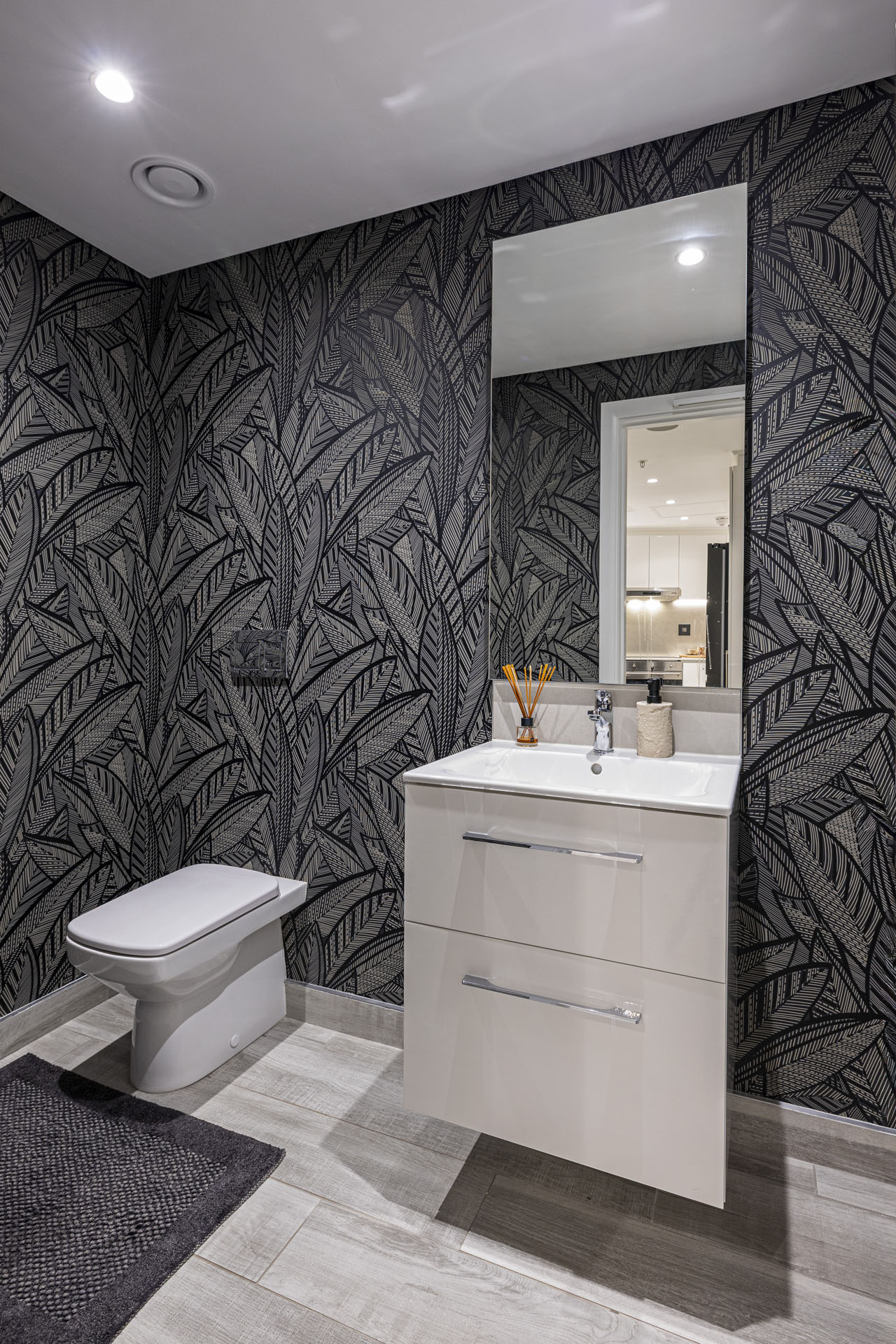 Guest powder room with bold wallpaper