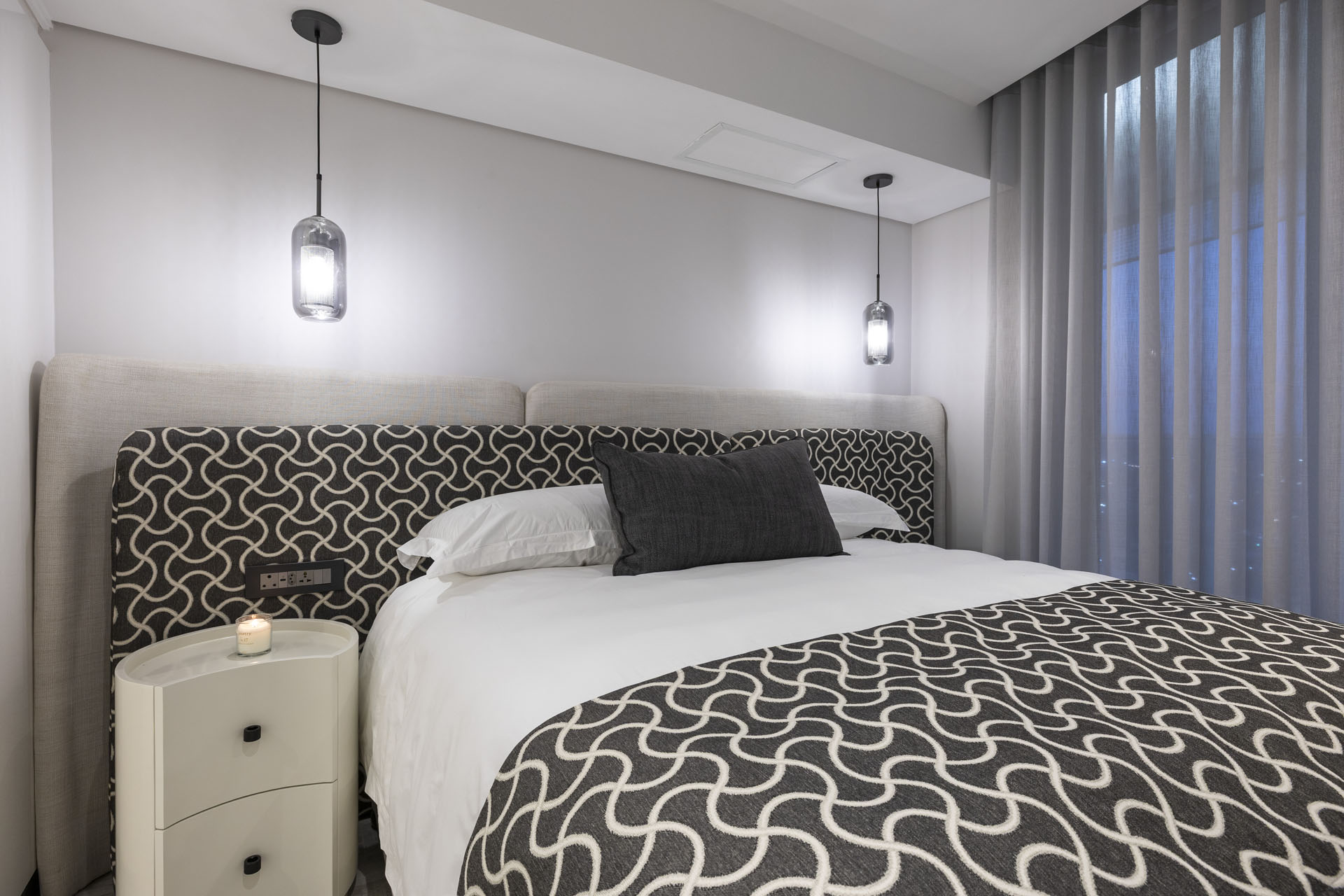 Luxury bedroom with pendant lighting
