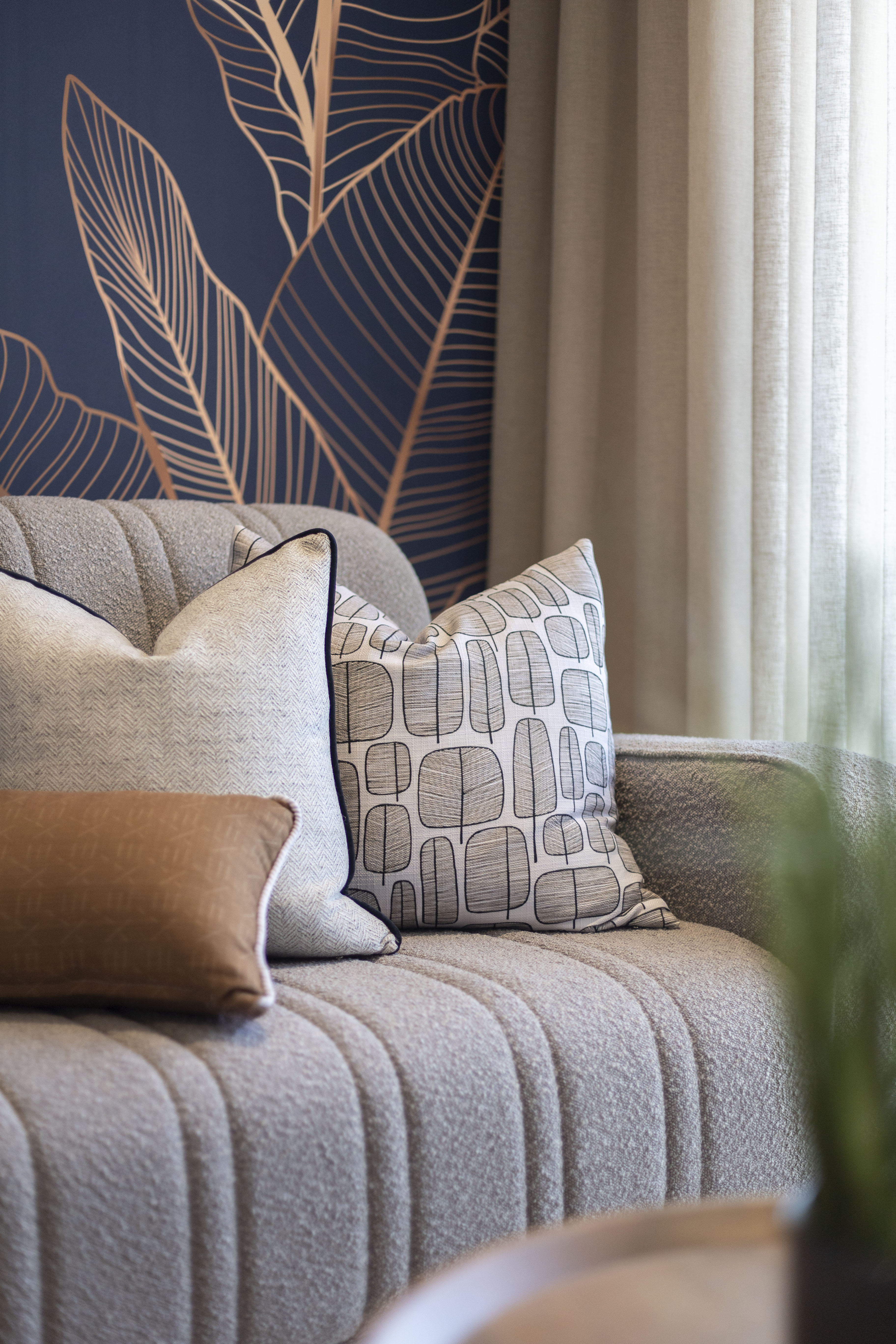 Lounge area with grey sofa and warm tones