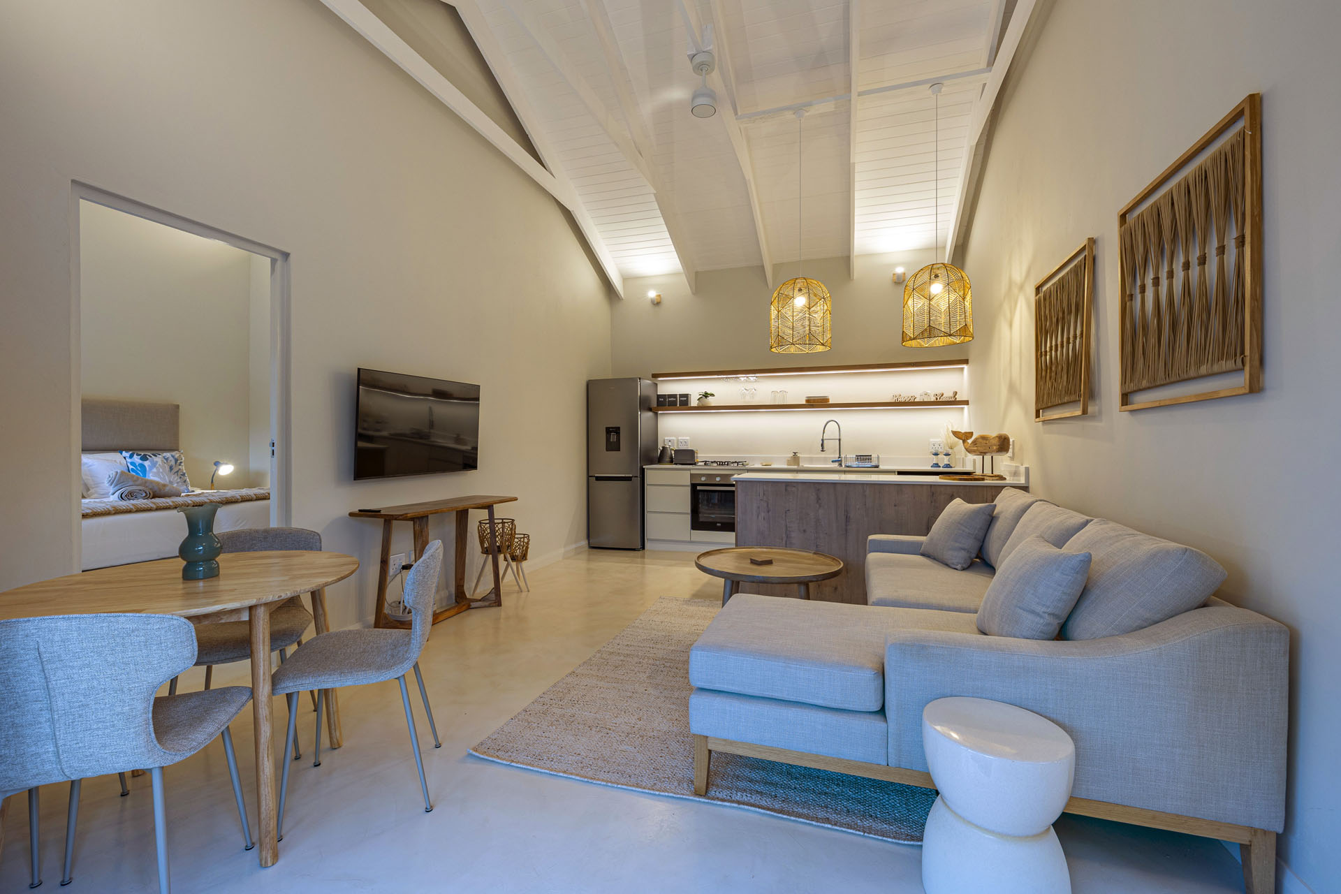 Living room with coastal decor and wooden whale sculpture